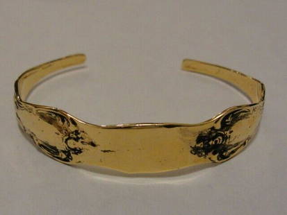 Sterling Silver and 14 kt Gold Vermeil Silverware Cuff Bracelet: From the earliest of times people have worn their wealth. It wasn't until after World War 2 that the use of sterling silverware declined, mainly because so many Europeans lost their wealth and