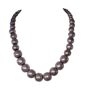 Mexican Graduated Hand Made Sterling Silver Hollow Bead Necklace Silver Pearls: Mexican Hand Made Sterling Silver Hollow Bead Necklace Silver Pearls Circa 1970s. Measures 18 1/2" long and 1/2" wide. Hand crafted pearl silver beads graduate from 5 mm's to 14 mm's diameter. Closes