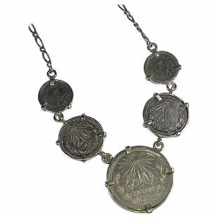 Alberto Juan Mexican Handmade Sterling Silver Coin Necklace: This Alberto Juan one of a kind necklace was handmade from Mexican silver coins with one 50 cent coin, two 20 cent coins, and two 5 cent coins of silver .720. The chain and findings used in this