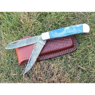 Folding double pocket damascus steel knife sky bone: Blade - damask steel Handle – bone Leather sheath – included Blade hardness – 55-58 HRC Total length – 8,5 (inch) Blade length - 4 (inch) Blade Thickness – 3-4 mm Knives