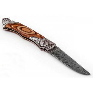 Exclusive pattern pocket folding damascus steel knife: Blade - damask steel Handle – wood, steel bolsters Leather sheath – included Blade hardness – 55-58 HRC Total length – 7,75 (inch) Blade length - 4 (inch) Blade Thickness