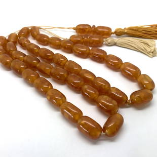 Two Amber Tesbih made from Barrel shaped Amber beads: Title: Two Amber Tesbih made from Barrel shaped Amber beadsMetal Purity: NoneGemstone: AmberWeight: 58.9 gSize: Bead size: 11.6 x 17.15 mm Bead size: 0.457 x 0.675 inches Made of: Whole