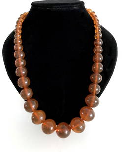 Impressive Unique Vintage Amber Necklace made from Round Amber beads: Title: Impressive Unique Vintage Amber Necklace made from Round Amber beadsMetal Purity: NoneGemstone: AmberWeight: 66.6 gSize: Bead size: 21.1 mmMade of: Reconstituted AmberAdditional Information: