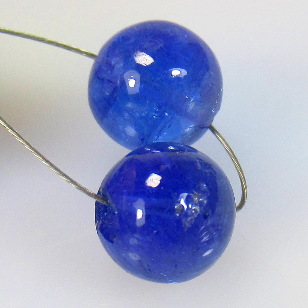 9.45 Ctw Natural 2 Drilled Tanzanite Round Beads: No Reserve! Title: 9.45 Ctw Natural 2 Drilled Tanzanite Round Beads Stone Clarity: Transparent Gemstones: Tanzanite Beads Carat Weights: 9.45 Size/Dimensions: 7.80 - 8.20 mm / 2 PC's Additional Inform