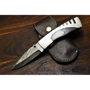 Handmade pocket folding damascus steel knife horn: Knife "Auto" made of damask steel. Handle – bull horn and scabbard - leather. Damascus knives are very durable, look great and keep sharpness perfectly. Damascus steel has high quality contents