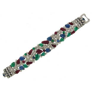 Carved Ruby Sapphire Emerald Diamond White Gold Tutti-Frutti Bracelet: Title: Carved Ruby Sapphire Emerald Diamond White Gold Tutti-Frutti BraceletDescription: An elegant Tutti-Frutti ("fruit salad") bracelet of contemporary make in the style of the Art Deco era. The