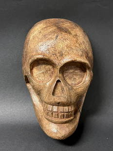 Skull: Title: SkullDate/Period: 20th CenturyDimension: 9.5 inches high x 3.5 inches depth x 6 inches wideMaterials: WoodAdditional Information: Carved Wood Paper Mache Mold of Skull Reserve: $80.00 