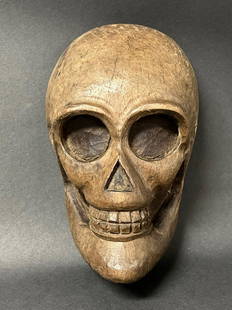 Skull: Title: SkullDate/Period: 20th CenturyDimension: 8 inches high x 3 inches depth x 5.25 inches wideMaterials: WoodAdditional Information: Carved Wood Paper Mache Mold of Skull Reserve: $80.00 