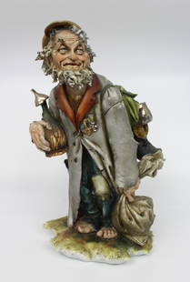 Capodimonte Tramp by Tyche Bruno: Capodimonte Tramp by Tyche Bruno. Capodimonte, made in Italy. Mid/late 20th century. Height: 26 cm. Good condition; possible old repair to lid of pot and few nibbles. Signauture of artist to the