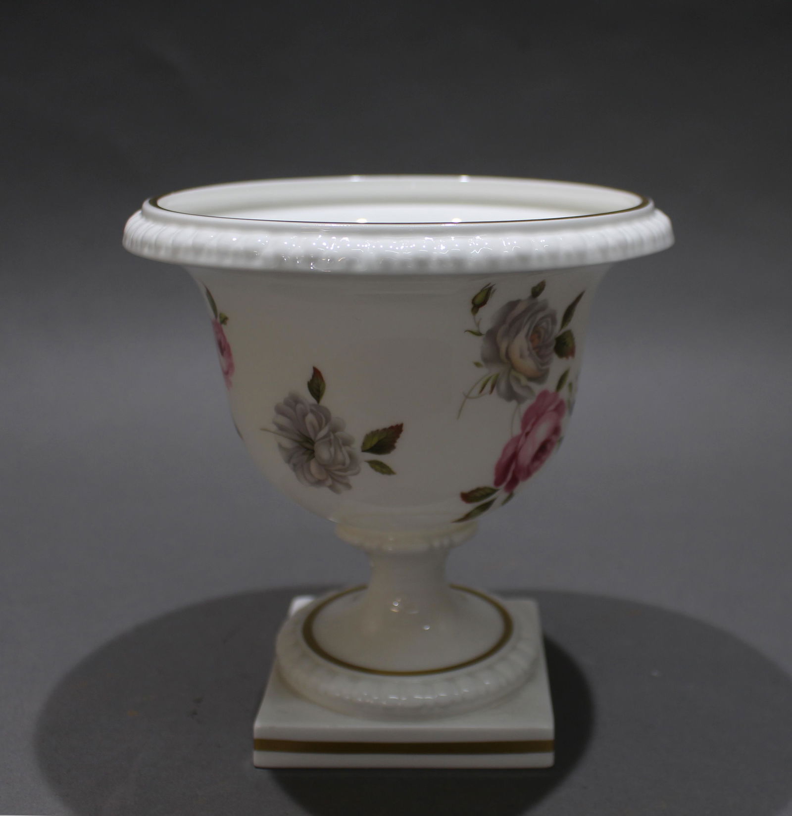 Royal Worcester Marissa Footed Campana Vase: Royal Worcester Marissa Footed Campana Vase Royal Worcester. Made in England. 1974. Floral decoration on white ground with gilding. Black first quality backstamp to underside. Measures 14.5 x 14.5