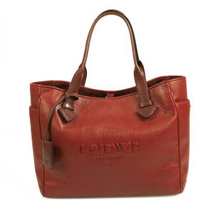LOEWE dark red pebbled lambskin leather medium sized tote shopper bag: LOEWE dark red pebbled lambskin leather medium sized tote shopper bag This stylish handbag is a stunning LOEWE medium tote bag. It is impeccably designed in dark red pebbled leather that has embedded