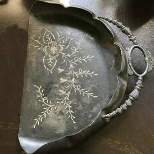 St. Louis Silver Co. Silver Butler's Helper: Title: St. Louis Silver Co. Silver Butler's HelperDescription: This Butler's helper looks like it may be bent, but it is not. It is just the shadowing.Date/Period: Early 1900'sMaterials: Silver &