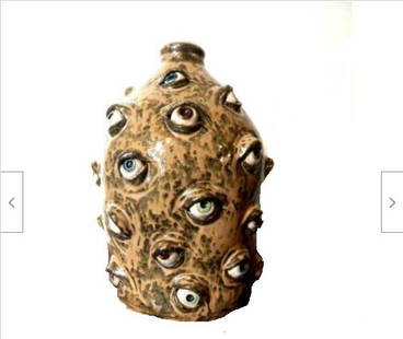 Lynn & Albert Walton- Tan Spit Glazed "Myriad of Eyes" Face Jug: Title: Lynn & Albert Walton- Tan Spit Glazed "Myriad of Eyes" Face JugDescription: Lynn Thurman Walton is a folk artist from north Georgia. She creates extraordinary, expressive Features on her