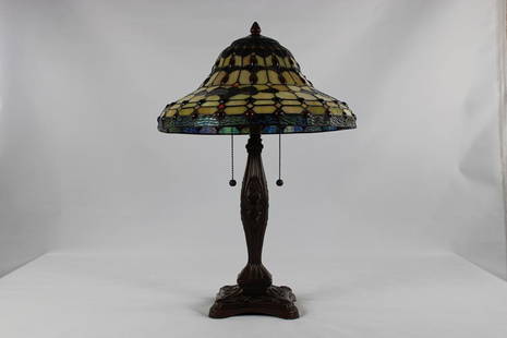 Stained Glass Lamp: Title: Stained Glass LampDescription: Unbranded Tiffany like LampDate/Period: 20th CenturyMaterials: Glass & varying metalsDimension: 24"H x 16"W x 16"D Reserve: $260.00 Shipping:Domestic:
