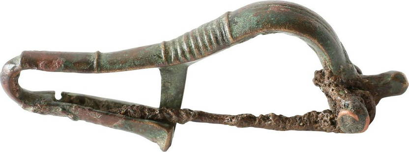 ROMAN BROOCH (FIBULA), C.50-200 AD: 1st-3rd century AD. Then time of Christ. The original garment pin patented two millennia later as the "safety pin". Bronze, 2 1/4" in length, of elegant form, probably for a womanâ€™s garment.