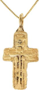 EASTERN EUROPEAN CHRISTIAN CROSS: 17th-18th century, Orthodox rite. Gilt bronze, just over 1 5/8" (1.66") in height. Relief decorated. The front with a vacant cross surrounded by Cyrillic ciphers and charges above. Reverse bordered