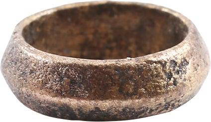 RARE VIKING BEARD RING, 10th-11th CENT. AD: Gilt bronze. Ridged band, 3.4 mm thick. 0.34". 8.6mm inside dimension, 11.3mm, 0.44" outside. The use of beard rings by Viking warriors is well documented but surviving examples are rare.