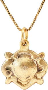 EXCEPTIONAL VIKING HEART PENDANT NECKLACE, 10TH-11TH: Over 5/8" width. Natural form heart of high domed section centered, with broad foliate edge and nubs at the quarter points describing a saltire. Well preserved with the intricate detail intact. The