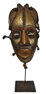 Mask – Wood, Metal – Tikar – Cameroon: Title: Mask – Wood, Metal – Tikar – CameroonDescription: Beautiful wooden mask with brass strips from the Tikar people of Cameroon. Stylistic mask with a warm appearance. Contains