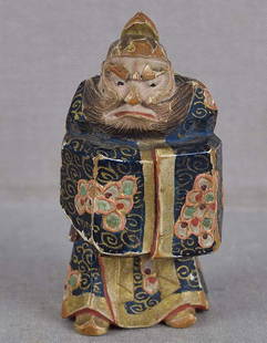 19c saishiki netsuke SHOKI the Demon Queller by NAGAMACHI SHUZAN: 19th century boxwood netsuke of standing Shoki the Demon Queller wearing a long robe, his hands folded within wide sleeves, his face in a severe concentration. Superb severe face, wonderful flow to