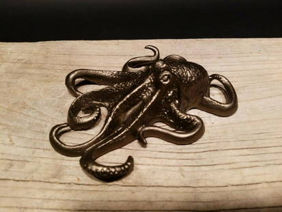 Brass Octopus Paperweight: 5 1/2" long x 4" Wide Wonderful well made reproduction of an antique octopus paperweight. The paper weight is hollow not solid so it is a more manageable weight. Darkened to look old. Certainly easy