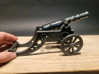 Cast Iron Art Deco RMI Model Cannon Toy: 9" overall length x 4 1/2" tall x 3 1/4" wide Nice quality reproduction cast iron RMI cannon. Great quality display! All our items come with a 100% customer satisfaction guarantee. Reserve: $25.00 