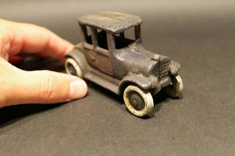 Cast Iron Sedan Toy Car: 4" Long x 1 5/8" Wide 2 1/4" Tall Such a neat reproduction cast iron car! As you can see this heavy cast iron car was wonderfully hand painted and distressed to look original. The car is mostly dark b