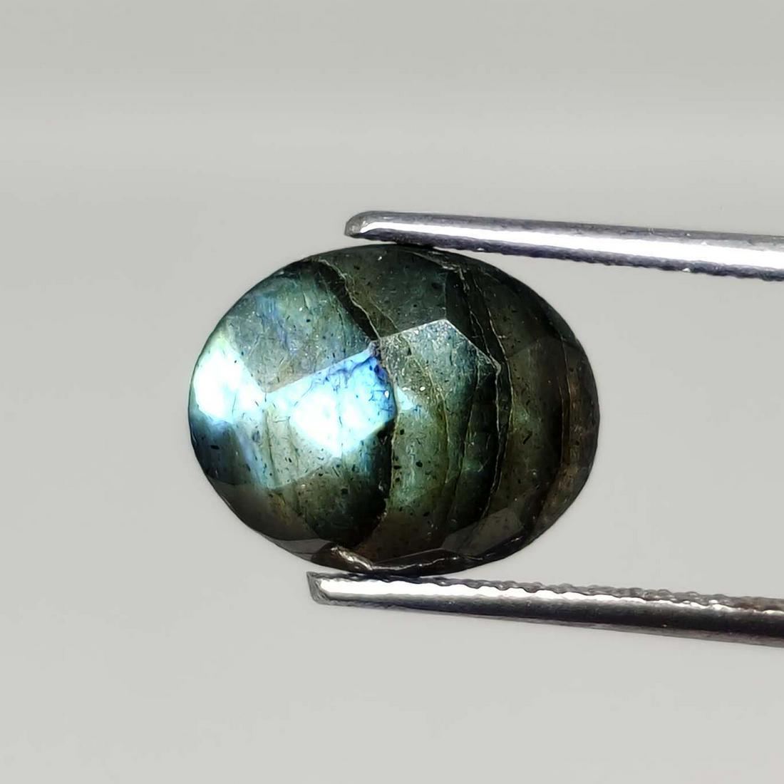 3.45 ct Natural Faceted Labradorite: No Reserve! Title: 3.45 ct Natural Faceted Labradorite Additional Info: Gemstones: Labradorite Carat Weights: 3.45 ct Size/Dimensions: 9 X 11 mm Origin : Labrador Materials & Techniques: Labradorite W
