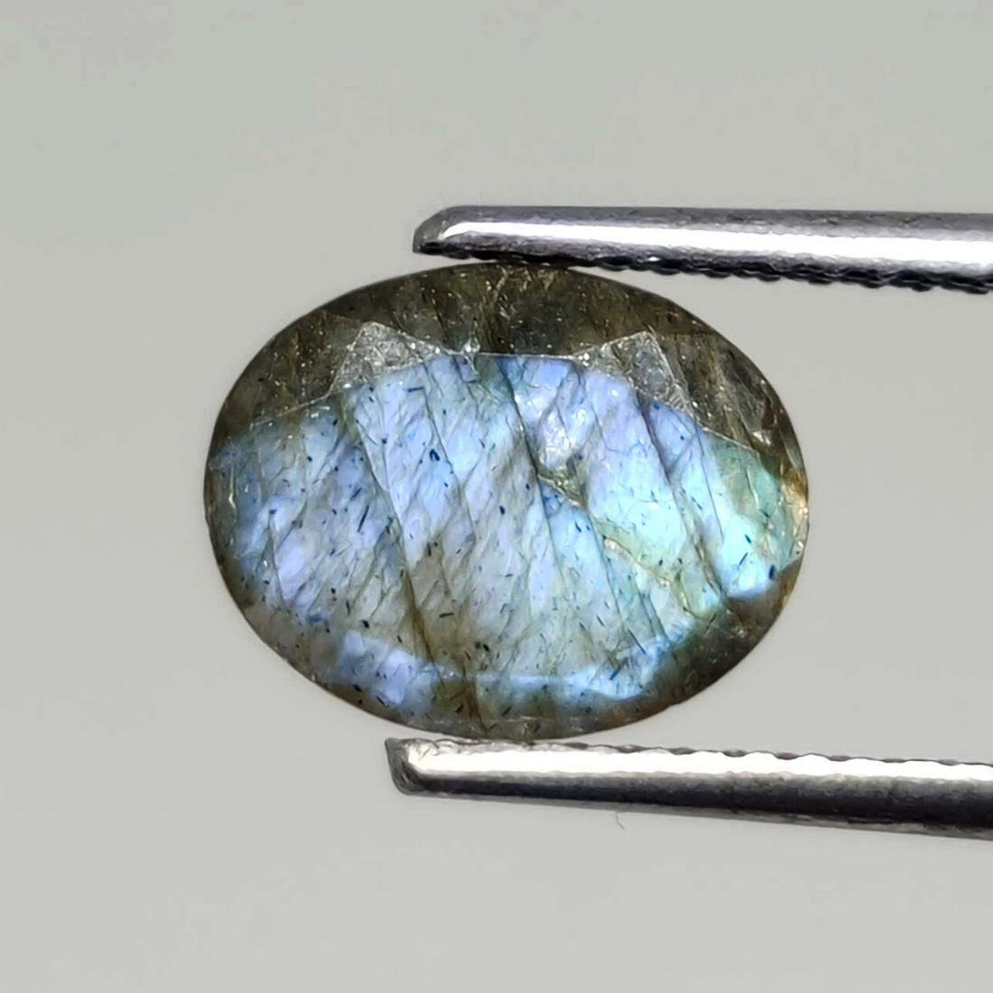 1.40 ct Natural Faceted Labradorite: No Reserve! Title: 1.40 ct Natural Faceted Labradorite Additional Info: Gemstones: Labradorite Carat Weights: 1.40 ct Size/Dimensions: 9 X 7 mm Origin : Labrador Materials & Techniques: Labradorite We
