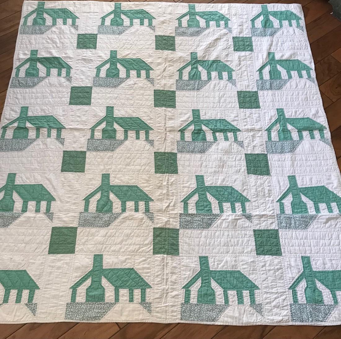 House Quilt: Nice quilt with houses from the 1930s. Note the full chimneys and simulated grass in front of each house. Measures 74.5” by 67” and is in excellent condition: no tears or repairs. Comes wi