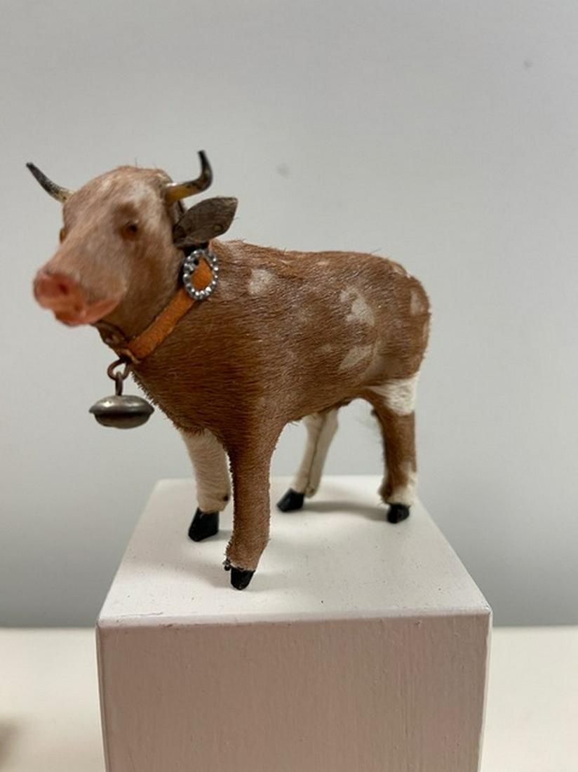 EXQUISITE HIDE COVERED MINIATURE COW WITH GLASS EYES: Title: EXQUISITE HIDE COVERED MINIATURE COW WITH GLASS EYES Additional Information: ORIGINAL COLLAR AND BELL, GERMAN CIRCA1910 - 4X3 Shipping: Domestic: Flat-rate of $15.00 to anywhere within the cont