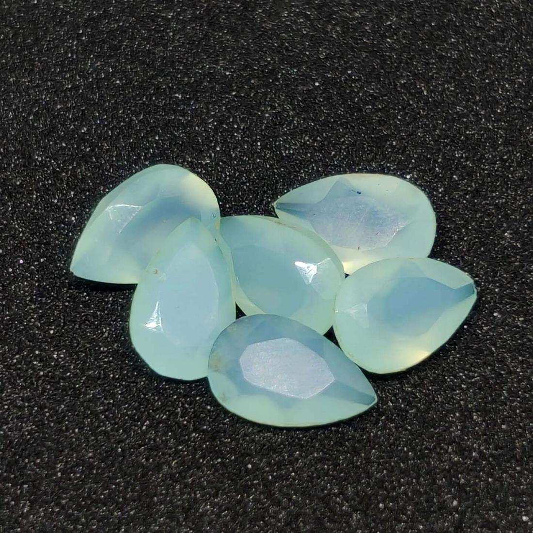 4.35 ct Natural Aqua Chalcedony Faceted Lot: No Reserve! Title: 4.35 ct Natural Aqua Chalcedony Faceted Lot Additional Information: Gemstones: Chalcedony Carat Weights: 4.35 ct Size/Dimensions: 8 X 5 mm Materials & Techniques: Chalcedony Weight