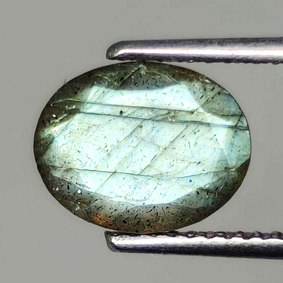 1.50 ct Natural Faceted Labradorite: No Reserve! Title: 1.50 ct Natural Faceted Labradorite Additional Information: Gemstones: Labradorite Carat Weights: 1.50 ct Size/Dimensions: 9 X 7 mm Origin : Labrador Materials & Techniques: Labrado