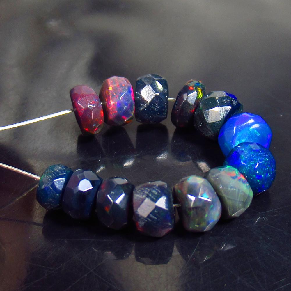 4.63 Ctw Natural 13 Drilled Faceted Black Opal Beads: No Reserve! Title: 4.63 Ctw Natural 13 Drilled Faceted Black Opal Beads Stone Clarity: Translucent Gemstones: Faceted Black Opal Beads Carat Weights: 4.63 Size/Dimensions: 4.00 to 5.30 mm / 13 PC's Ad