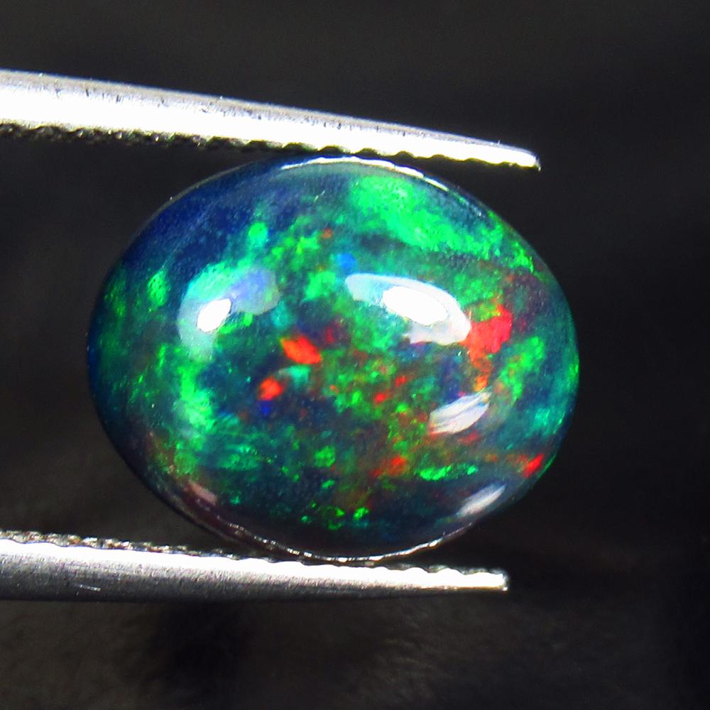 2.17 Ctw Natural Ethiopian Black Fire Opal Oval Cab: No Reserve! Title: 2.17 Ctw Natural Ethiopian Black Fire Opal Oval Cab Stone Clarity: Translucent Gemstones: Black Opal Carat Weights: 2.17 Size/Dimensions: 11.20 x 9.40 x 4.60 mm Additional Informati