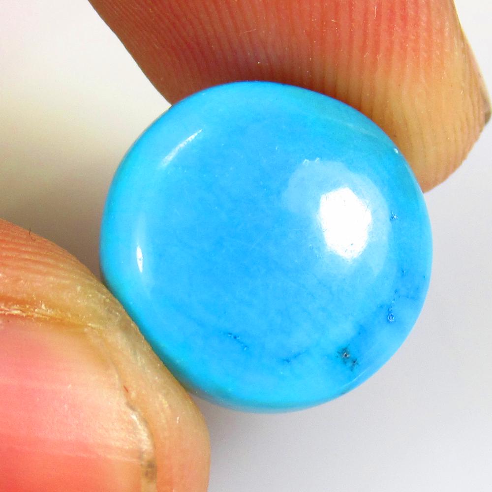 9.08 Ctw Natural Blue Turquoise Round Cab: No Reserve! Title: 9.08 Ctw Natural Blue Turquoise Round Cab Stone Clarity: Opaque Gemstones: Turquoise Carat Weights: 9.08 Size/Dimensions: 14.00 x 14.00 x 5.20 mm Additional Information: Good Color 