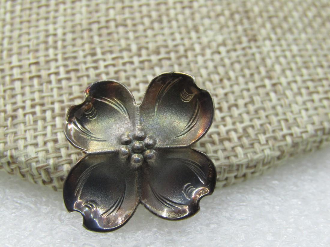 Vintage Sterling Stuart Nye Long Single Dogwood Clip Earring 7/8": Vintage Sterling Stuart Nye Single Dogwood Earring, Clip, 7/8", slightly ove. 1.55 grams. Staurt Nye Hand Wrought Sterling. Southern Highland Handicraft Guild Member. Piece is also signed and marked s