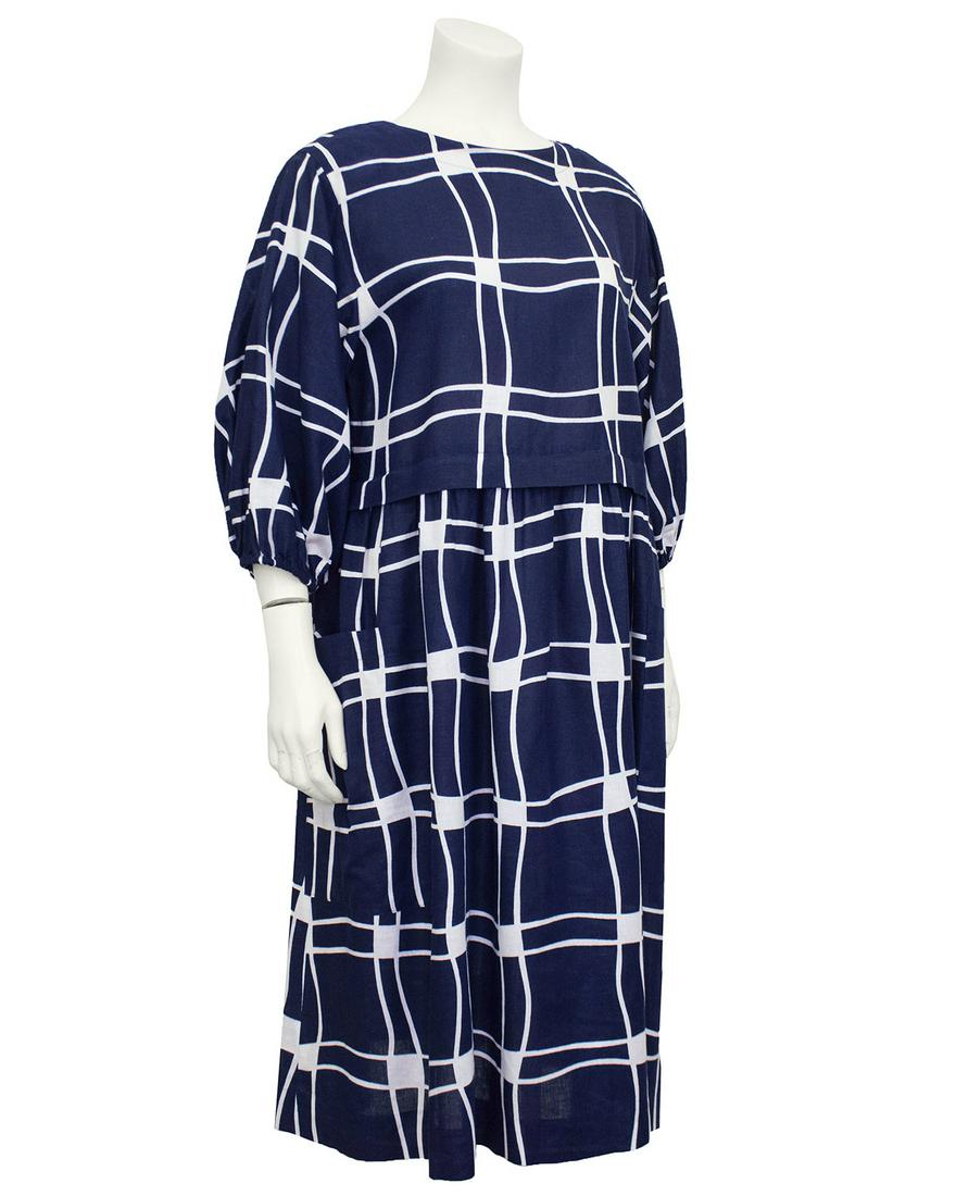 Guy Laroche : Navy Blue and White Cotton Dress: Adorable 1980s Guy Laroche cotton/linen blend midi peasant dress. Graphic navy blue and white pattern. Designed to fit slightly oversized and look like a top and skirt ensemble. Round neckline and 3/4