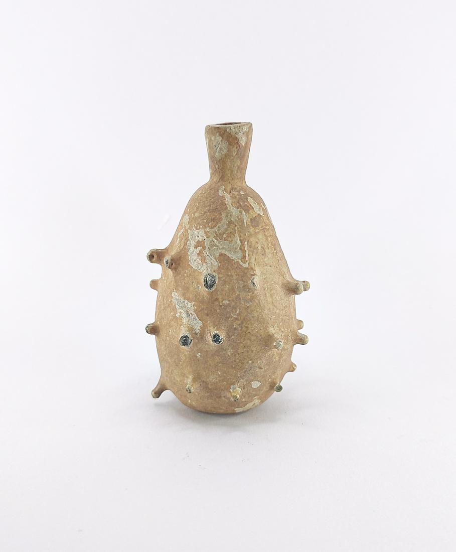 ANCIENT ISLAMIC POISON SPIKED GLASS BOTTLE: Title: ANCIENT ISLAMIC POISON SPIKED GLASS BOTTLE Description: Ca.700-900AD. Ancient Islamic glass poison bottle, with a band of spiked protrusions to body ;From a private London Collection formed in 