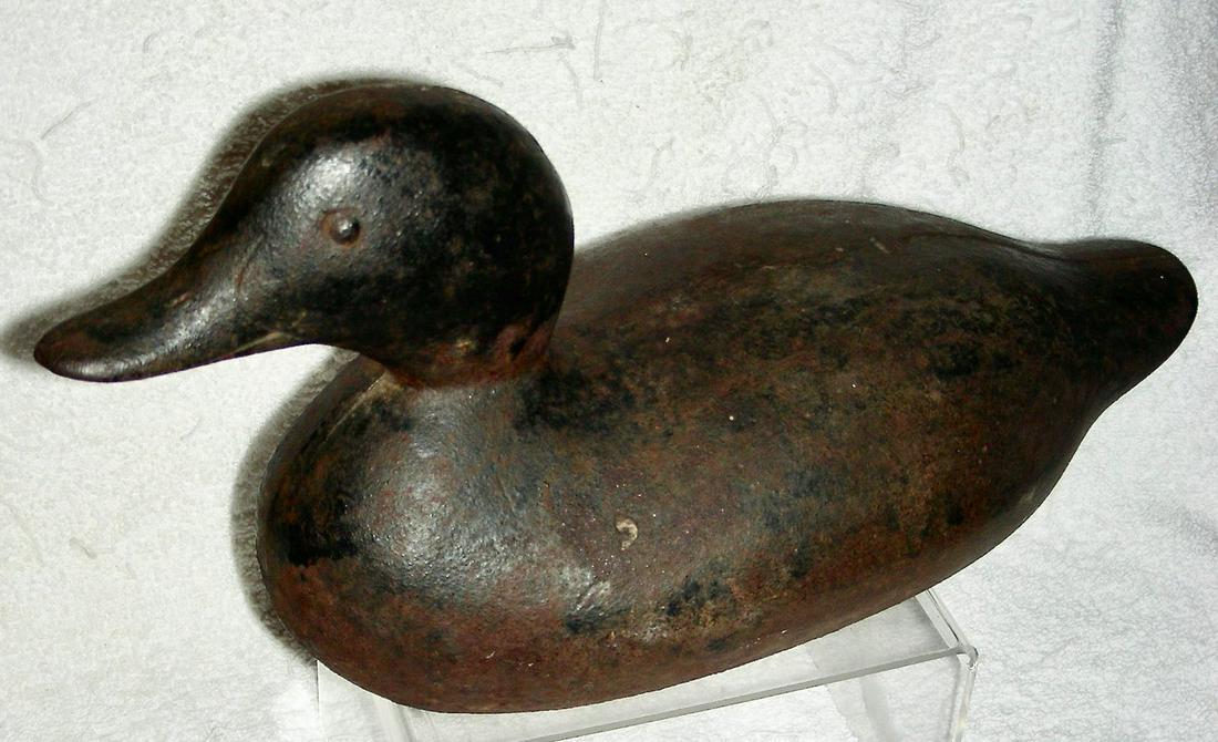 Iron Sink Box Duck Decoy c.1900: A cast iron Sink Box Duck Decoy dating to the very early 20th century, or a bit older. These iron decoys were used as ballast on sink boxes or punt boats that were used for hunting waterfowl. The boat