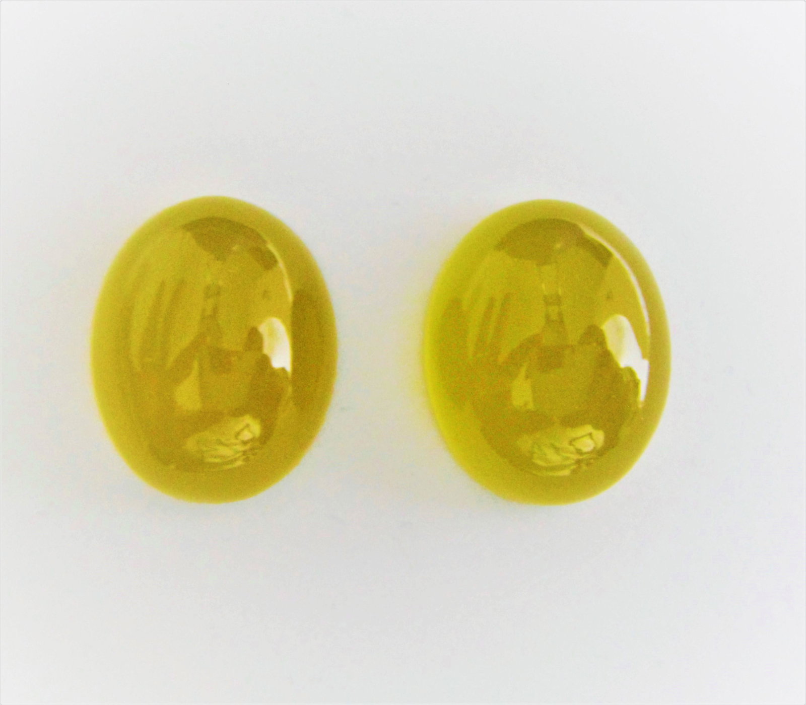 Lemon Quartz Pair – 48.40 ct: Title: Lemon Quartz Pair â€“ 48.40 ct Metal Purity: Natural Gemstones: Quartz Carat Weights: 48.40 ct Size/Dimensions: 16.00 x 20.00 x 10.00 and 16.00 x 20.00 10.10 mm Additional Information: Nat