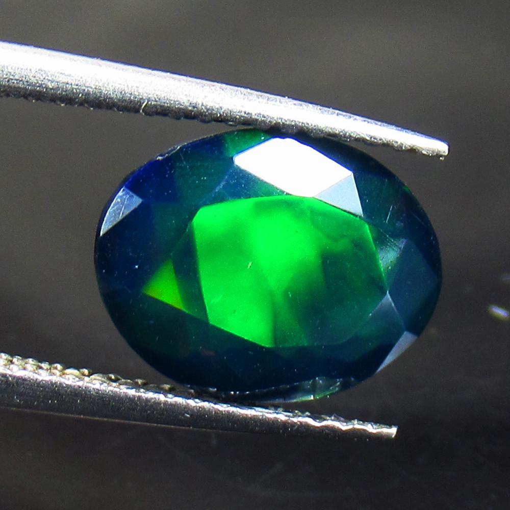 1.95 Ctw Natural Ethiopian Black Fire Opal Oval Cut: No Reserve! Title: 1.95 Ctw Natural Ethiopian Black Fire Opal Oval Cut Stone Clarity: Translucent Gemstones: Black Opal Carat Weights: 1.95 Size/Dimensions: 11.10 x 8.60 x 4.90 mm Additional Informati