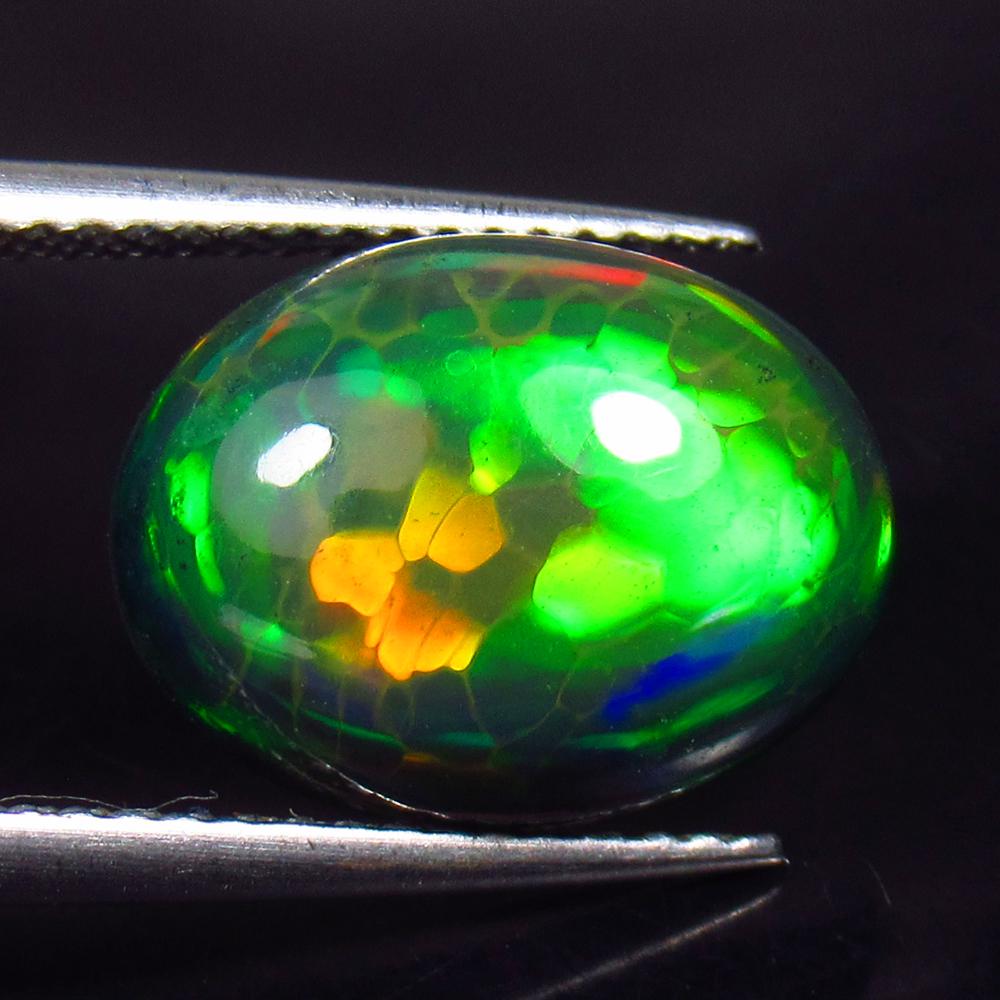 3.61 Ctw Natural Black Fire Opal Oval Cabochon: No Reserve! Title: 3.61 Ctw Natural Black Fire Opal Oval Cabochon Stone Clarity: Semi - Transparent Gemstones: Natural Opal Carat Weights: 3.61 Size/Dimensions: 13.40 x 10.20 x 5.40 mm Additional Info