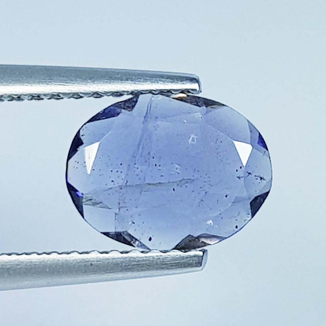 0.89 Ct Natural Iolite Oval Cut: No Reserve! Title: 0.89 Ct Natural Iolite Oval Cut Color/Clarity: SI Gemstones: Loosegemstone Carat Weights: 0.89 Size/Dimensions: 8.90 x 6.90 x 2.20 Additional Info: Oval - Africa Shipping: Domes