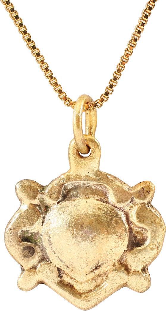EXCEPTIONAL VIKING HEART PENDANT NECKLACE, 10TH-11TH: Over 5/8" width. Natural form heart of high domed section centered, with broad foliate edge and nubs at the quarter points describing a saltire. Well preserved with the intricate detail intact. The he