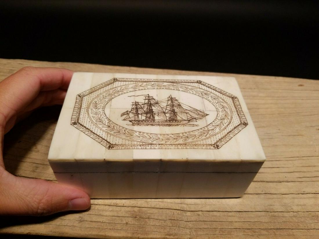 Folk Art Sail Ship Scrimshaw Etched Bone & Wood Trinket Box: 6 3/8" Long x 3 7/8" Wide x 1 5/8" High Wonderful new reproduction scrimshaw carved ox bone box. As you can see this piece is tiled with bone on wood and decorated with a design typical of the period.