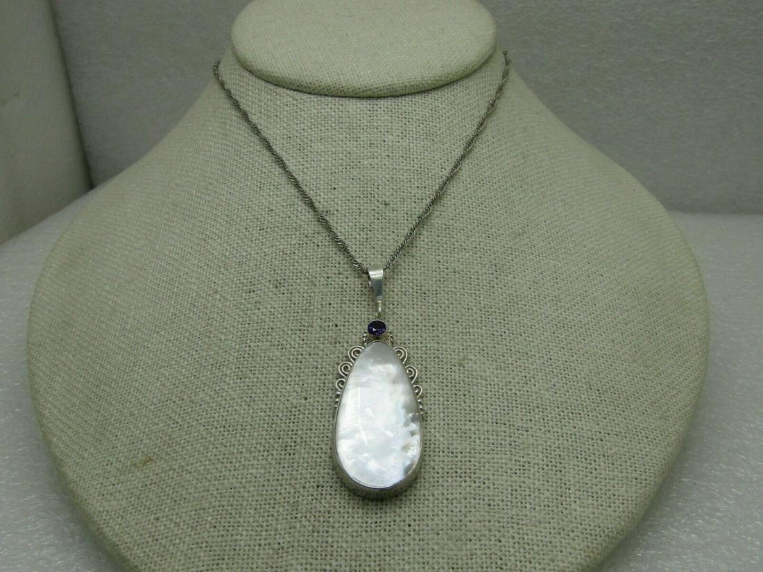 Vintage Sterling Mother-of-Pearl Amethyst Necklace, 19.5", 10.72 gr. Boho/SWest: Vintage Sterling Mother-of-pearl Amethyst Necklace, signed AF with a southwestern and Boho loo, scrolled accents, swing bail. 2.25" long and 3/4" wide. Weight is appx. 10.72 grams. The chain is a diam