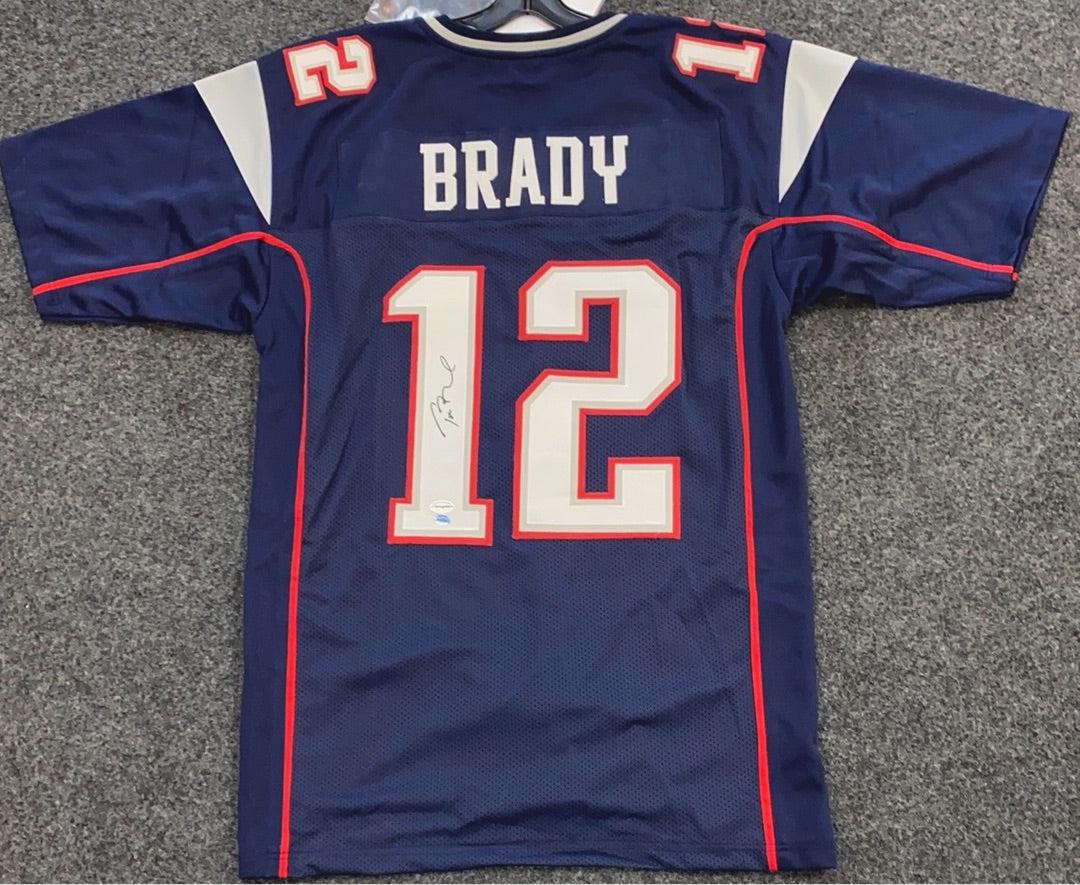 Tom Brady New England Patriots Signed Jersey - Blue: Title: Tom Brady New England Patriots Signed Jersey - Blue Description: Tom Brady New England Patriots Signed Jersey - Blue Dimensions: 12”x12”x2” Reserve: $875.00 Shipping: Domestic