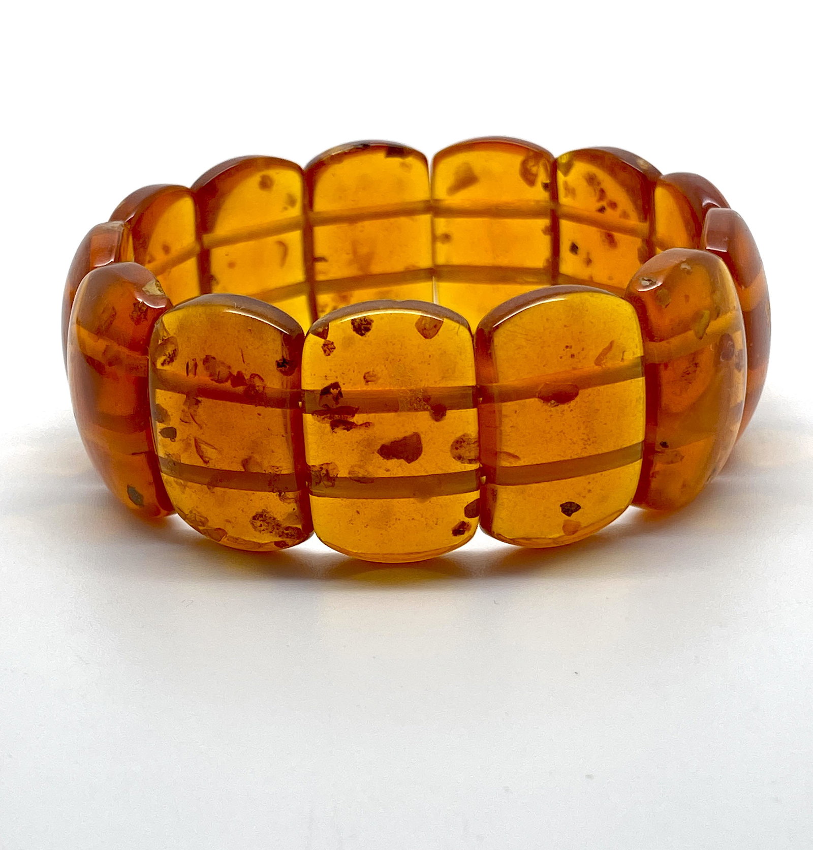 Unique and Magnificent Amber Bracelet made from Plate like Amber beads: Title: Unique and Magnificent Amber Bracelet made from Plate like Amber beads Metal: None Gemstones: Amber Weight: 34.8 g Size: Bead size: 26.0 x 16.0 mm Bead size: 1.024 x 0.63 inches Made of: Recons