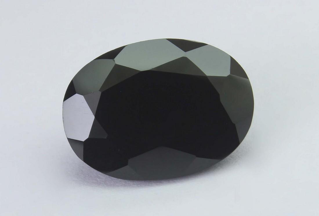 16.52 Cts Natural Black Spinel: No Reserve! Title: 16.52 Cts Natural Black Spinel Additional Information: Gemstone : Natural Black Spinel Shape and cut : Oval Cut Weight : 16.52 Carats Measurements : 18x13 mm Color : Black Transpran